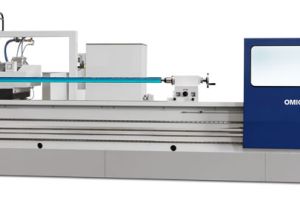 Moving wheelhead, cylindrical grinder with roll grooving attachment