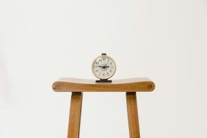 clock on a table, white background